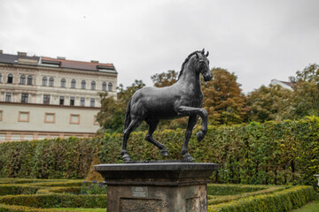 Prague, Czech Republic - September 14, 2022: Beautifully designed Wallenstein Garden with art statue in front of Wallenstein Palace (Valdstejnska Zahrada). Currently the home of the Czech Senate. High