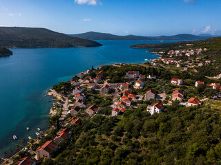 Stunning aerial shot of a Croatian coastal town with a clear blue sea