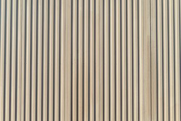 Obraz premium corrugated metal door with beige painted vertical lines, rich textured background for design