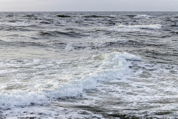 Breaking Ocean Waves at Seaside Shore with White Foam and Spray - Concept of Power, Force, Change, Washing Away, Fleeting Life Experience