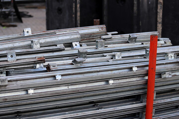 Metal racks stacked in a storage area at a construction site 