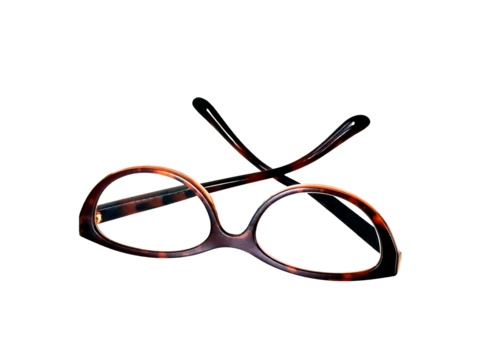 Pair of cat eye shape glasses wth a brown frame on a transparent background