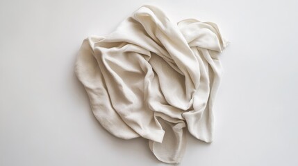 White textured fabric draped on a white surface showcasing folds and organic shapes with copy space for text placement