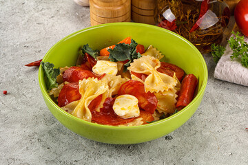 Italian pasta farfalle with pepperoni