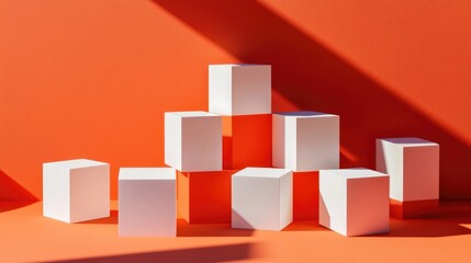 Colorful arrangement of white cubes on vibrant orange background with diagonal shadows and ample copy space.