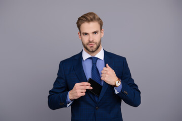Boss or employee always using phone for communication. Businessman isolated on grey. Successful...
