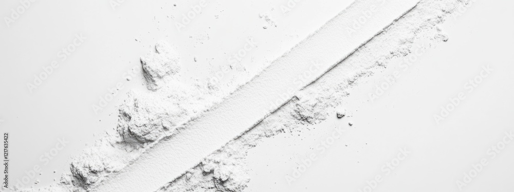 Poster white powder spread on a clean surface with a straight line and scattered piles for copy space usage