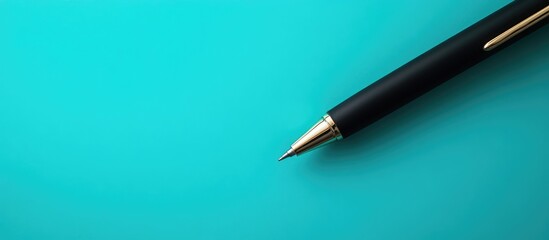 Black Pen on Vibrant Turquoise Background Minimalist Design Featuring Ample Copyspace for Text or Creative Messaging