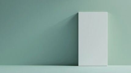 Obraz premium Modern minimalistic interior scene featuring a blank vertical panel against a light green wall with copy space for text.