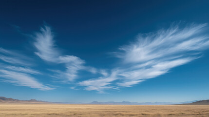 Serene Blue Sky Showcasing Delicate Cirrus Clouds Stretching Across the Horizon