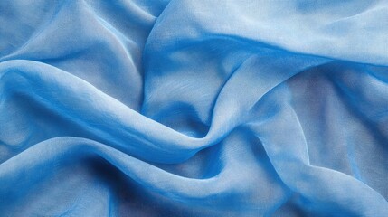 Obraz premium Light blue sheer fabric texture with soft folds and wrinkles, abstract textile background with copy space.