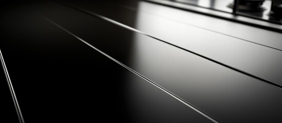 Black Stripes on Smooth Dark Surface of a Stove with Empty Copyspace for Text for Advertising or Design Purposes