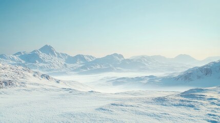 Snowy mountain landscape with distant peaks and soft blue sky Copy Space