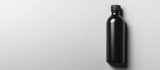 Black Water Bottle Mockup on Minimalistic White Background Ideal for Brand Presentations and Advertising Text Placement