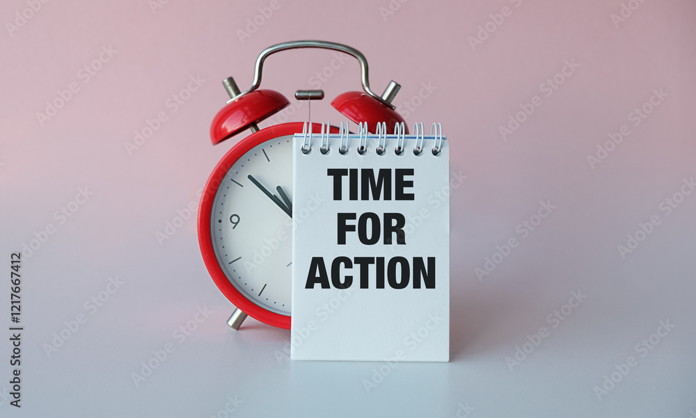 Poster time for actioninscription on a notebook near a red alarm clock on a light background