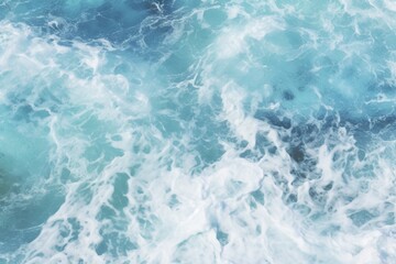 Obraz premium Beautiful Ocean Water Texture Background. Blue Beach Waves Crashing with Foam. Drone View of Empty Abstract Seashore