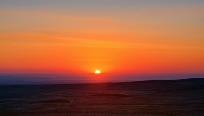 Fototapeta premium 멀리 수평선 위로 떠오르는 선명한 일출, 붉고 따뜻한 색감의 태양