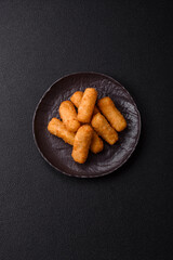 Delicious crispy cheese sticks with mozzarella, salt and spices