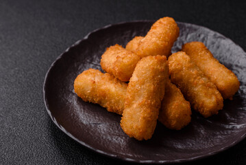 Delicious crispy cheese sticks with mozzarella, salt and spices