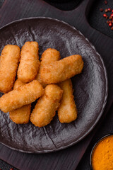 Delicious crispy cheese sticks with mozzarella, salt and spices
