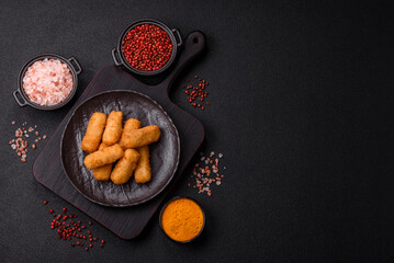 Delicious crispy cheese sticks with mozzarella, salt and spices