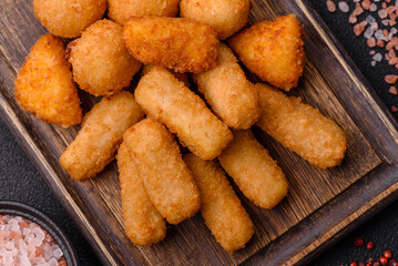 Delicious crispy cheese sticks with mozzarella, salt and spices