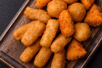 Delicious crispy cheese sticks with mozzarella, salt and spices