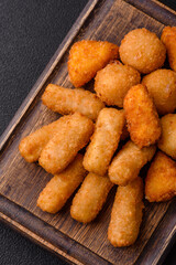 Delicious crispy cheese sticks with mozzarella, salt and spices