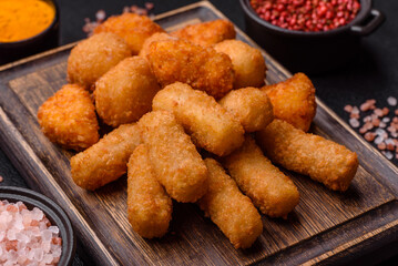 Delicious crispy cheese sticks with mozzarella, salt and spices