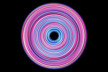 Pink purple neon rings in round texture. Glowing circular lines on a black backdrop. Vivid green luminescent vortex. Futuristic energy flow. Cosmic sun design. Glow circle effect.