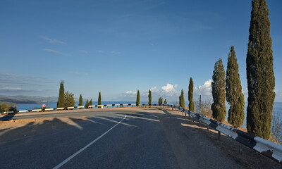 Russia, Republic of Crimea. View of the winding paved road along the Black Sea coast near the town...