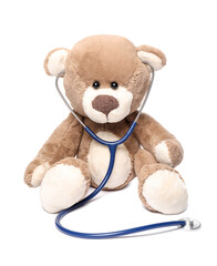 Pediatrics concept. Teddy bear with stethoscope isolated on white