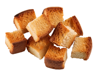 Crunchy croutons falling on transparent background, ready to add flavor and texture