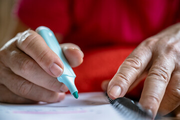CloseUp of a person highlighting notes