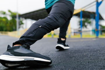 Fototapeta premium Latino athlete stretching legs wearing sportswear in colombia