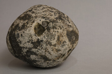 An extremely simple still life with a single mineral on a light background.