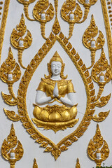 A decoration on wall inside the Buddhist temple Wat Phra That Nong Bua, Thailand