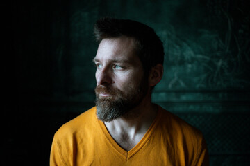Fototapeta premium handsome man portrait on a dark background