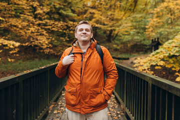 30s Plus size male with backpack smiling outside on an adventure. Hiking, lifestyle, adventure and...