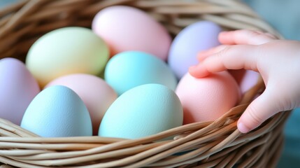 Fototapeta premium A colorful basket filled with eggs as a hand reaches out to select one, symbolizing the Easter celebration.