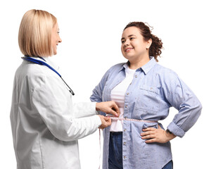Happy woman lost weight. Nutritionist measuring patient's waist with tape on white background