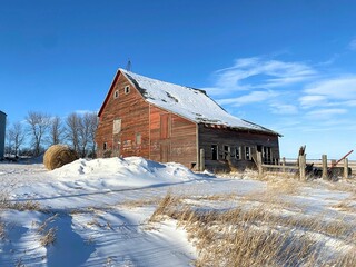 An old barn standing tall on the prairie