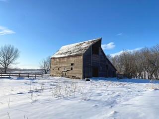 A barn in the snow, long abandoned but not forgotten