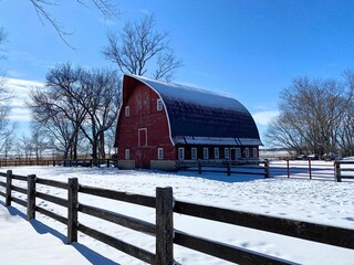 An iconic Gothic style livestock barn in the snow