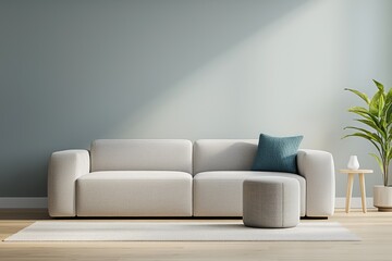 Cozy living room scene featuring a light sofa, decorative pillow, rug, and a plant against a pale wall.
