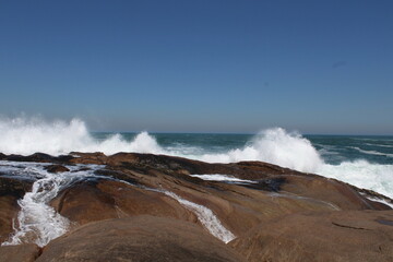 waves crashing on rocks