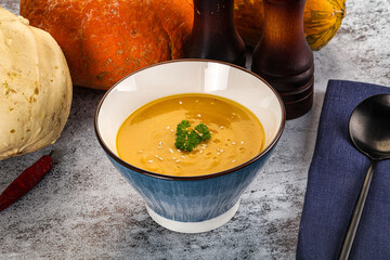 Vegan pumpkin cream soup served sesam