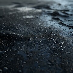 Atmospheric macro shot of water droplets on dark reflective surface creates moody ambiance, perfect for backgrounds, weather concepts, and minimalist design projects.