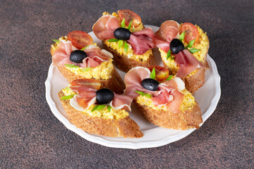 Bruschetta with jamon, egg and cherry tomatoes