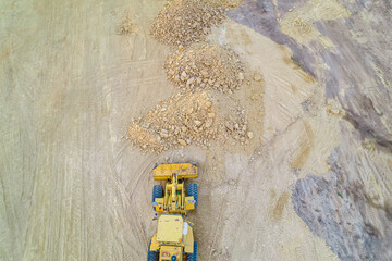 zenithal photograph of a bulldozer at a construction site, aerial top view with drone © VicVaz